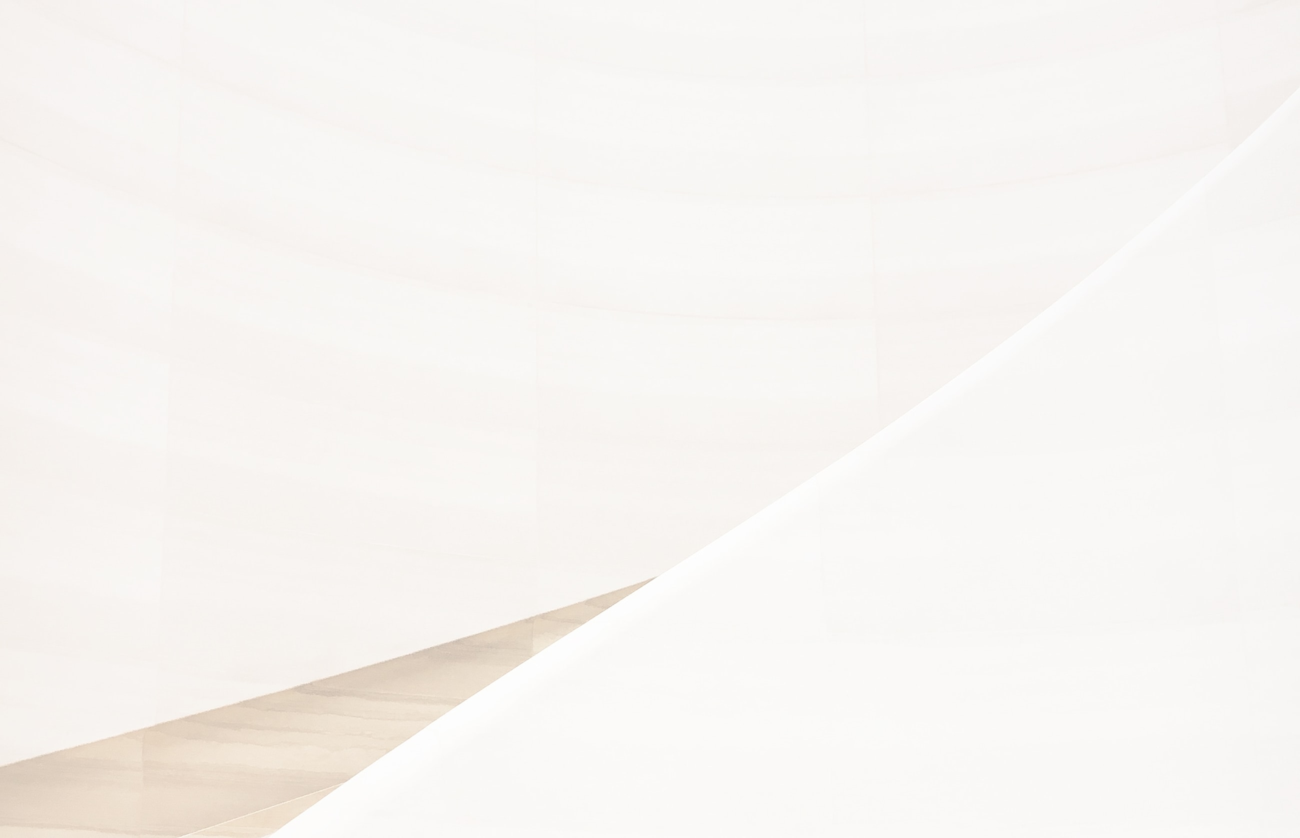 Abstract white architectural design with soft curves.