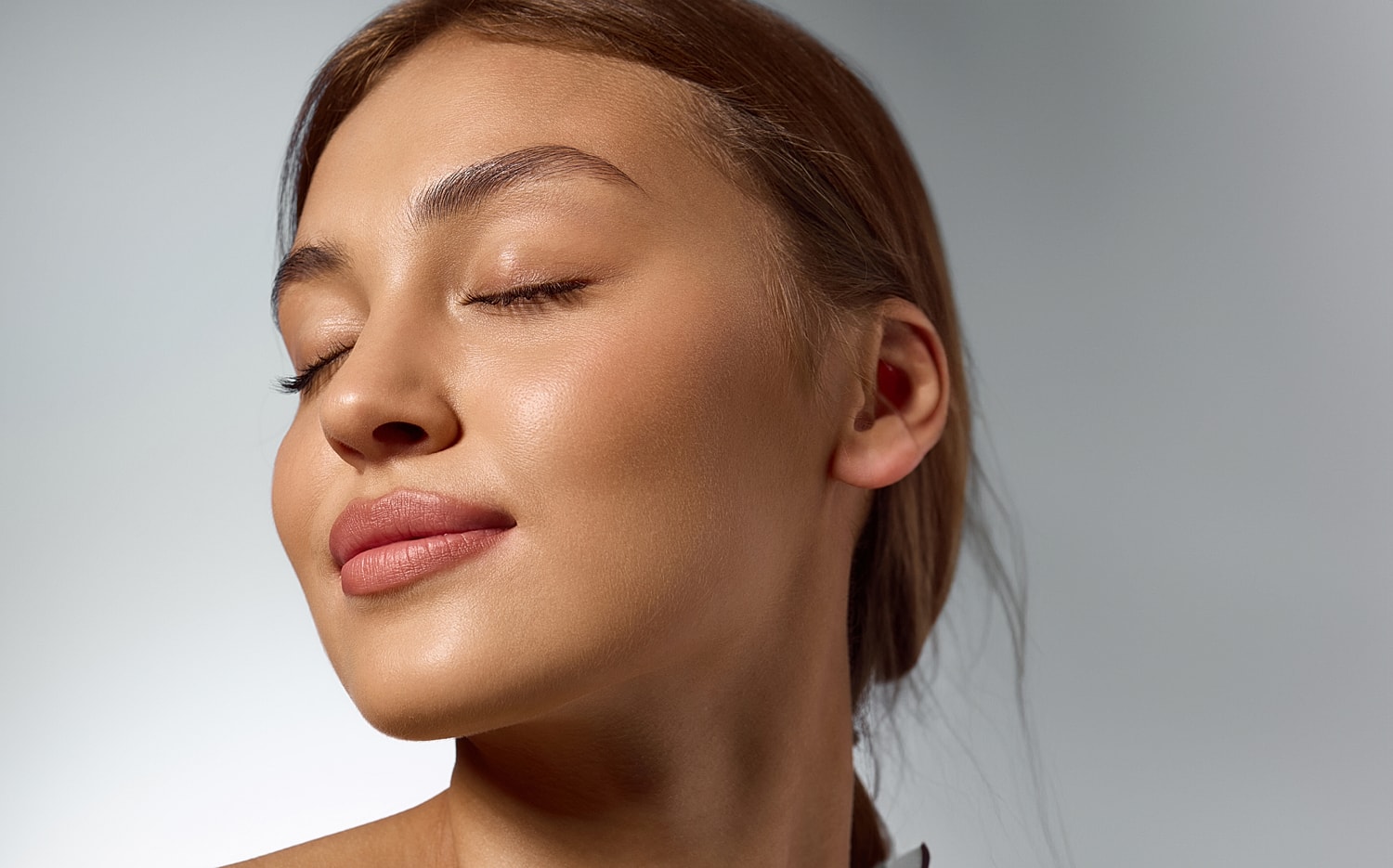 Close-up of woman with serene expression.